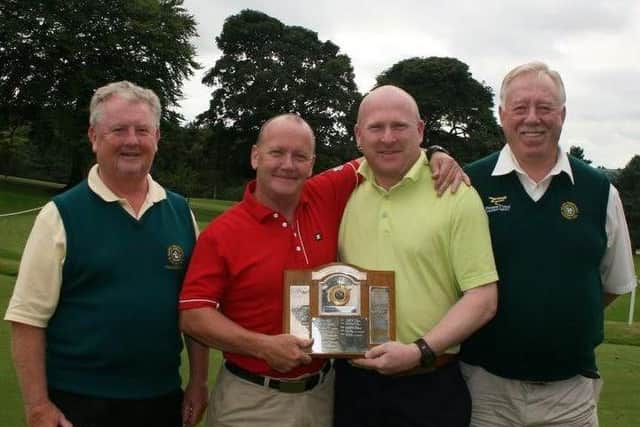 Halifax-Huddersfield Union fourball better ball winners Dean Hooson and Richard Whitworth, of Halifax GC, with, left, the union's president elect John Turner (Crow
Nest Park) and, right, Roy Lofts (Halifax Bradley Hall), a union executive member who ran the competition.