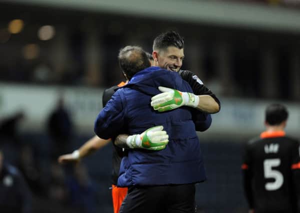 A delighted Owls keeper Keiren Westwood with Carlos Carvalhal. (Picture: Steve Ellis)