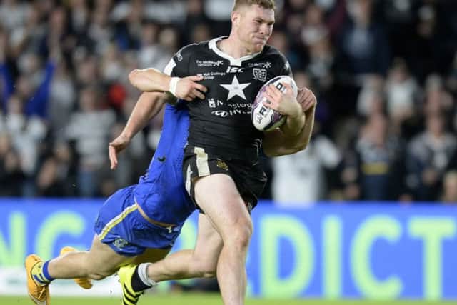 Scott Taylor carries Tom Lineham along during Hull FC's defeat by Warrington Wolves last Friday. (Picture: Bruce Rollinson)