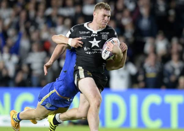 Scott Taylor carries Tom Lineham along during Hull FC's defeat by Warrington Wolves last Friday. (Picture: Bruce Rollinson)