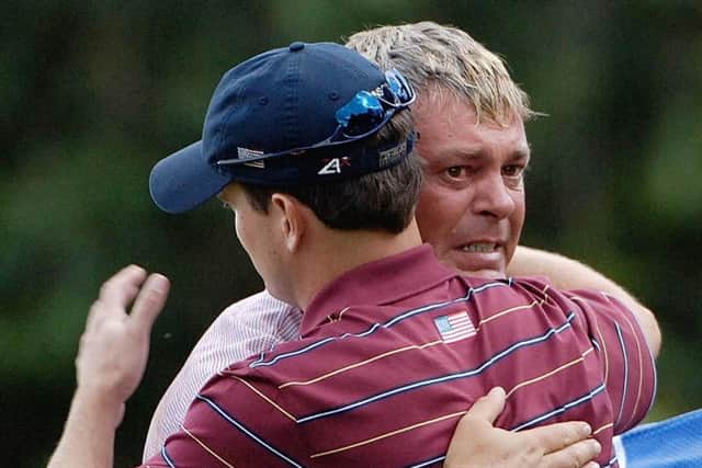 A tearful Darren Clarke hugs the USA's Zach Johnson after defeating him on the 16th hole on the final day of the 2006 Ryder Cup at the K Club in Ireland. Picture: Rebecca Naden/PA
