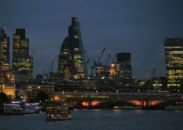 The City of London skyline at dusk, with Blackfriars Bridge in the foreground. Photo: Jonathan Brady/PA Wire