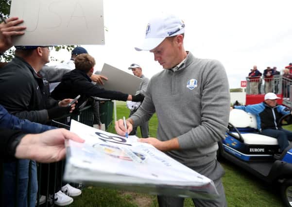 Europe's Danny Willett signs autographs for fans during a practice session ahead of the 41st Ryder Cup at Hazeltine. Picture: David Davies/PA.