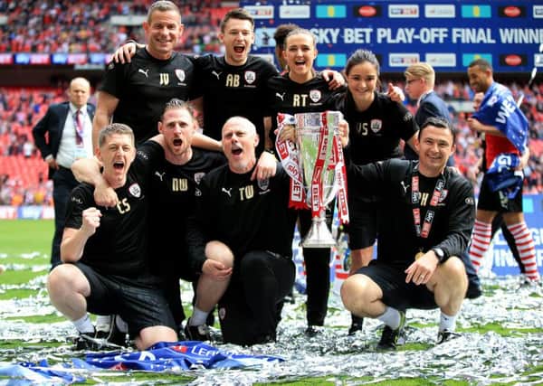 HAPPIER TIMES: Barnsley assistant head coach Tommy Wright (front row, second right), celebrates with fellow staff members after winning the League One play-off final at Wembley in May. Picture: Nick Potts/PA.