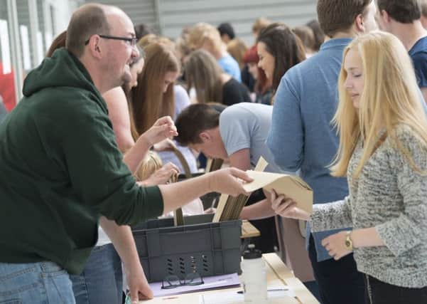 Students collect GCSE results at Horizon Community College in Barnsley.