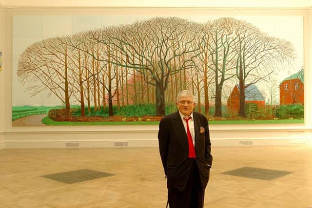 David Hockney in front of his painting, Bigger Trees Near Warter, inspired by the landscape of the Yorkshire Wolds