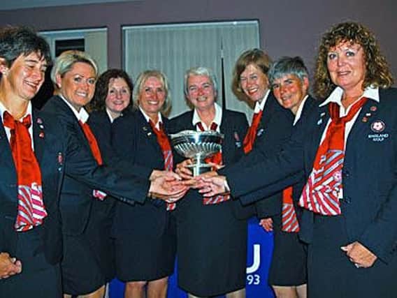 England seniors captain Pat Wrightson (Huddersfield), holding the trophy, with her victorious side including Richmond's Karen Jobling, second right.