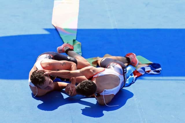 Great Britain's Alistair Brownlee (left) and brother Jonny embrace after winning Gold and Silver in the Men's Triathlon at Fort Copacabana on the thirteenth day of the Rio Olympic Games, Brazil. (Picture: Mike Egerton/PA Wire).