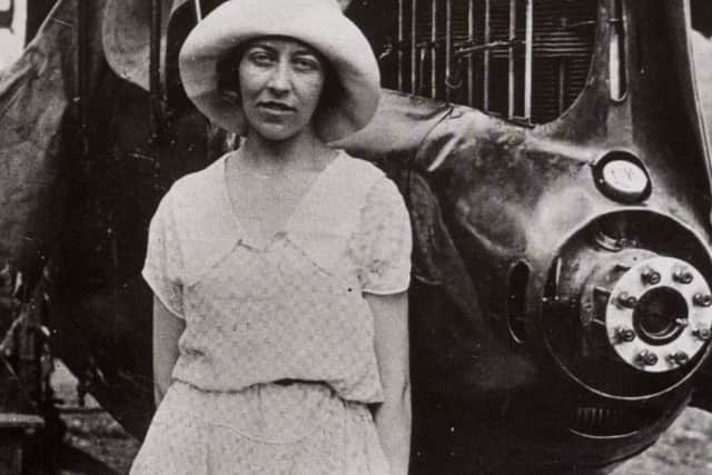 Amy Johnson, with her badly damaged plane in 1930