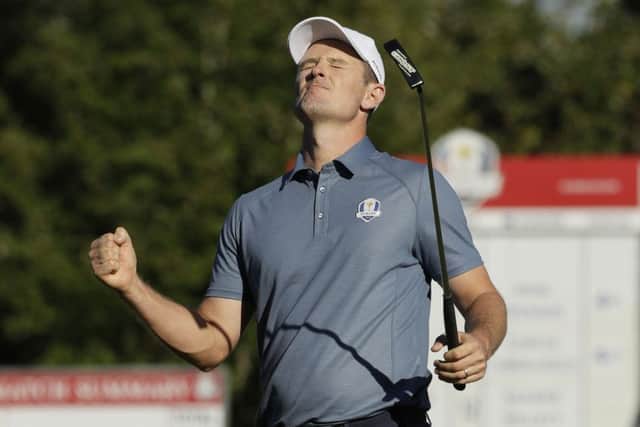 Europe's Justin Rose reacts after making a birdie on the 14th hole.