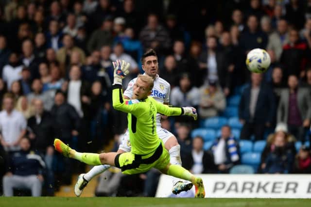 Barnsley goalkeeper Adam Davies can only watch as the ball flies past him as Pablo Hernandez nets Leeds Uniteds crucial second goal (Picture: James Hardisty).