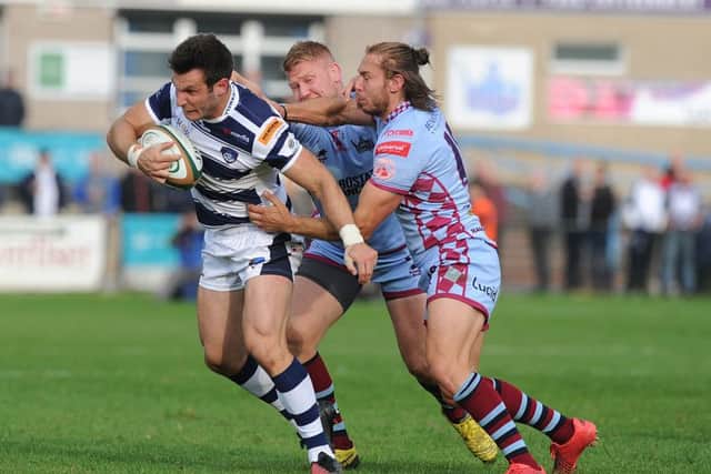 Yorkshire Carnegie's Warren Seals finds his route blocked by tenacious Rotherham Titans' defence. Picture: Scott Merrylees