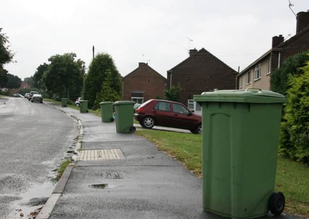 Green recycling bins out for collection