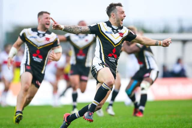Salford's Gareth O'Brien celebrates scoring the golden point to win the game and condemn Hull KR to relegation from Super League. Picture: Alex Whitehead/SWpix.com