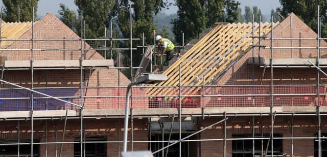 File photo of construction work on new homes, as output in Britain's construction industry grew for the first time in four months in September, following a "swift recovery" in housebuilding. Photo: Peter Byrne/PA Wire