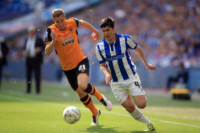 Hull City's Michael Dawson on the trail of Sheffield Wednesday's Fernando Forestieri at Wembley in May (Picture: Nick Potts/PA Wire).