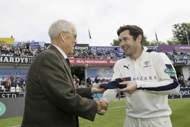 Yorkshire's Andrew Hodd is presented with his county cap by club president John Hampshire. Picture: Allan McKenzie/SWpix.com.