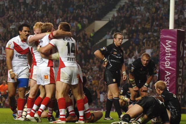 TEN YEARS ON: St Helens celebrate their final try against Hull FC in the 2006 Grand Final at Old Trafford. Picture: Bruce Rollinson.