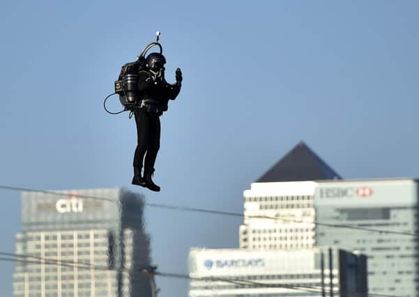 David Mayman pilots the JB-10 Jetpack flying machine over the Royal Victoria Docks in east London on its maiden flight. PIC: PA