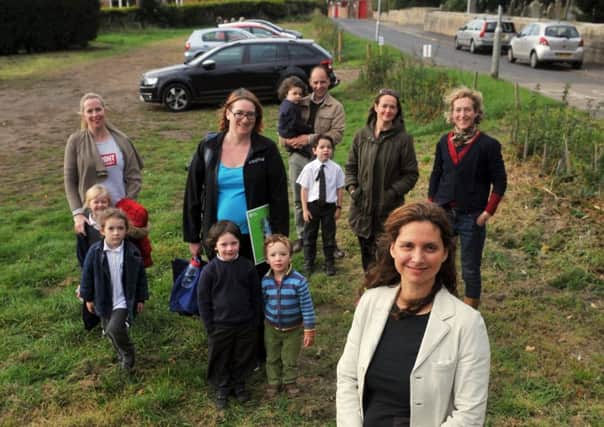 Katerina Gilbert with parents and pupils on the proposed car park, in Sharow near Ripon.