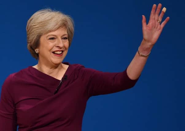 Theresa May greets her audience at the Tory Party conference on Wednesday. (PA).