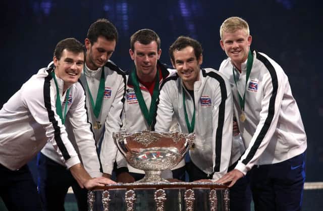 Andy Murray, second right, and Kyle Edmund, right, celebrate winning the Davis Cup last year. Picture: Andrew Milligan/PA.