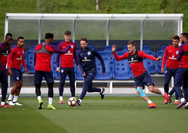 England caretaker manager Garerth Southgate, centre, during a training session with his players at St George's Park, Burton yesterday (Picture: Nick Potts/PA Wire).
