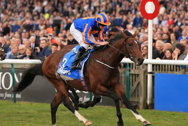 Churchill and Ryan Moore on their way to winning The Dubai Dewhurst Stakes at Newmarket. Picture: Nigel French/PA