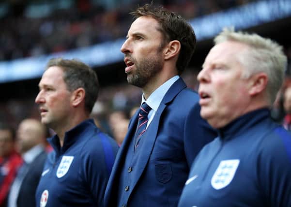 England caretaker manager Gareth Southgate (centre) with assistants Steve Holland (left) and Sammy Lee before the 2018 FIFA World Cup Qualifying match at Wembley Stadium, London. (Picture: PA)