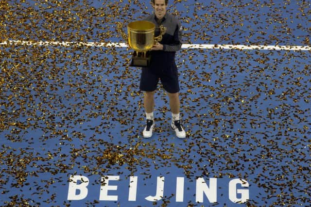 Andy Murray poses with his trophy after defeating Grigor Dimitrov of Bulgaria in the men's singles final of the China Open in Beijing. Picture: AP/Ng Han Guan