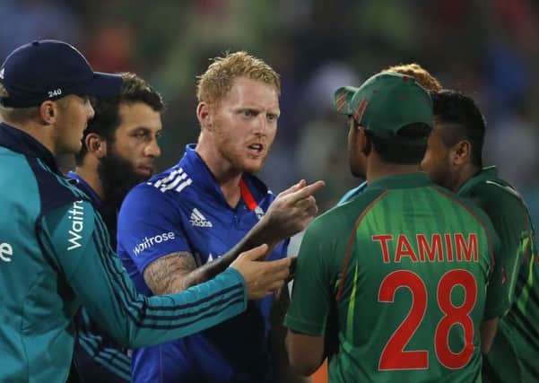 England's Ben Stokes, center, argues with Bangladesh's Tamim Iqbal at the end of the second one-day international cricket in Dhaka. Picture: AP Photo/A.M. Ahad