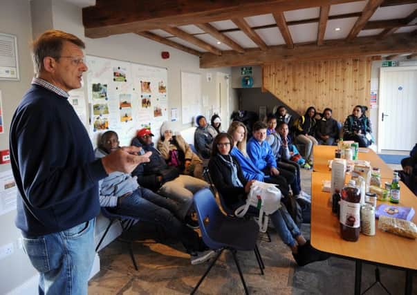 Farmer Robert Rook, from Market Weighton, welcomes students from Headlands School, Bridlington, and exchange students from South Africa, as a part a farm visit.  Pictures: Simon Hulme