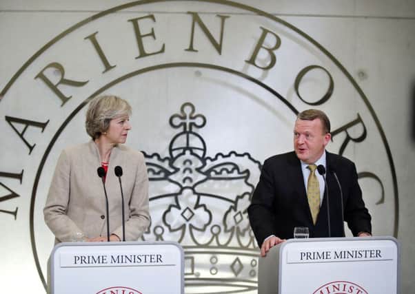 Denmark's Prime Minister Lars Loekke Rasmussen and Theresa May, during a press conference after their meeting, at the Prime Minister's Resident Marienborg, North of Copenhagen
