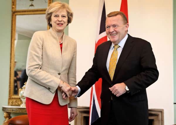 Theresa May meets her Danish counterpart Lars Loekke Rasmussen during Brexit talks yesterday.