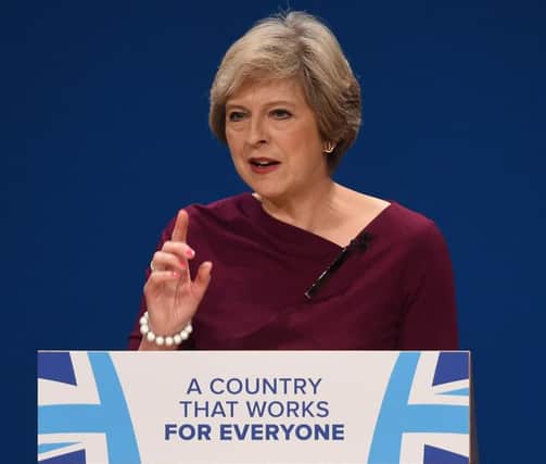 Prime Minister Theresa May gives her keynote address on the fourth day of the Conservative party conference at the ICC in Birmingham. PRESS ASSOCIATION Photo. Picture date: Wednesday October 5, 2016. See PA TORY stories. Photo credit should read: Joe Giddens/PA Wire