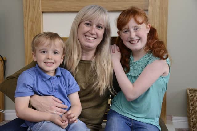 Jack Sowden, four, his mother Claire and sister and Olivia, ten.