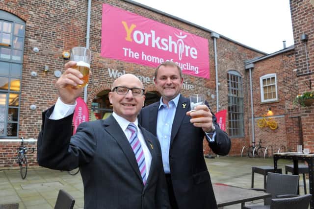 Charlie Jackson, Vice Chair at British Cycling and Sir Gary Verity, Chief Executive at Welcome to Yorkshire raise a glass of Yorkshire bitter to celebrate Yorkshire winning the bid to host the  2019 UCI Road World Championships. Picture: Tony Johnson