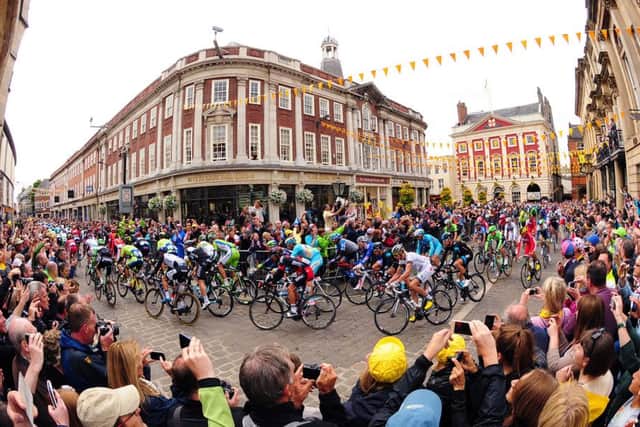 The 2014 Tour De France navigates its way through York, passing Bettys Tea Rooms and the Mansion House.