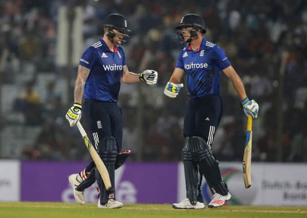 KEEP IT GOING: England captain Jos Buttler, right, and Ben Stokes drive each other on during the third ODI against Bangladesh in Chittagong. Picture: AP/AM Ahad.