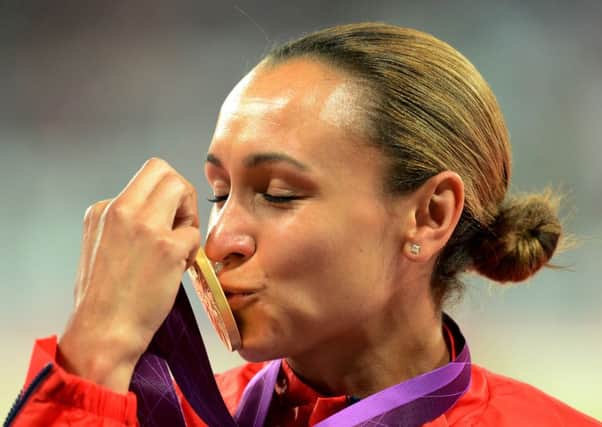 CROWNING GLORY: Jessica Ennis celebrates with her gold medal after winning the heptathlon at London 2012. Picture Owen Humphreys/PA
