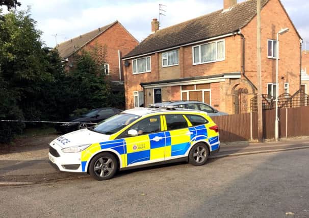 Police outside a house in Colchester, after a baby boy was killed and a second child injured in a dog attack.