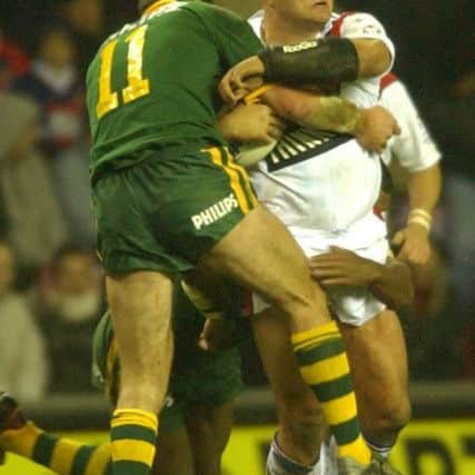 FEEL THE FORCE: Paul Anderson finds his path blocked while playing for Great Britain against Australia at Wigan back in 2003. Picture: Steve Riding