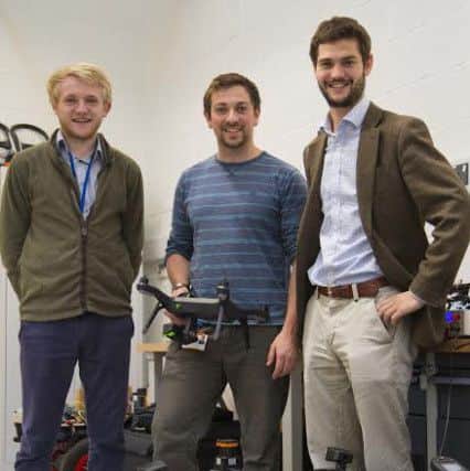 From left to right: Hands Free Hectare researchers Martin Abell, Jonathan Gill and Kit Franklin in one of the engineering laboratories at Harper Adams University.