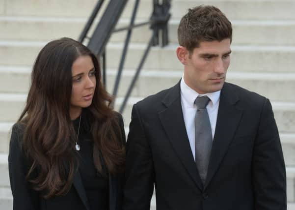 Footballer Ched Evans and partner Natasha Massey outside Cardiff Crown Court, where he has been found not guilty of raping a teenager in a hotel