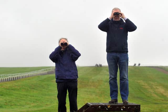 Trainer Karl Burke (right) with his father in law Alan Jarvis watching some of his horses on the gallops at Middleham. (Picture: Gary Longbottom)
