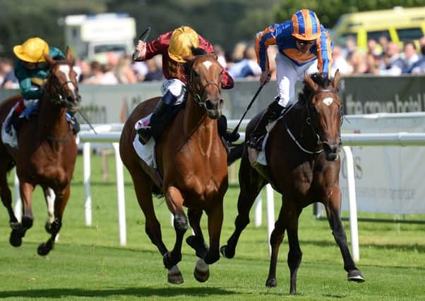 Simple Verse ridden by Oisin Murphy (centre) beats Pretty Perfect to win the DFS Park Hill Stakes at the St Leger Festival at Doncaster last month. Picture: Anna Gowthorpe/PA