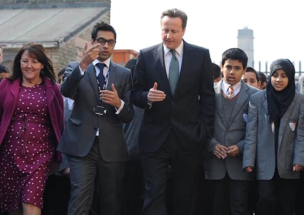 Former Prime Minister David Cameron and the Kings Science Academy's founder and former principal Sajid Hussain Raza in 2012 during the school's first year. Photo : Anna Gowthorpe/PA Wire