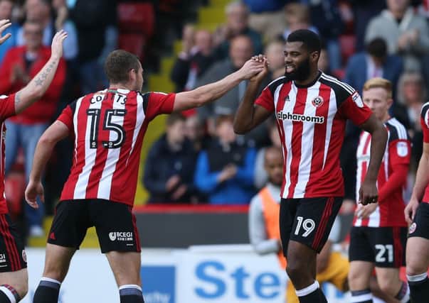Ethan Ebanks-Landell of Sheffield Utd celebrates scoring the first goal with Paul Coutts