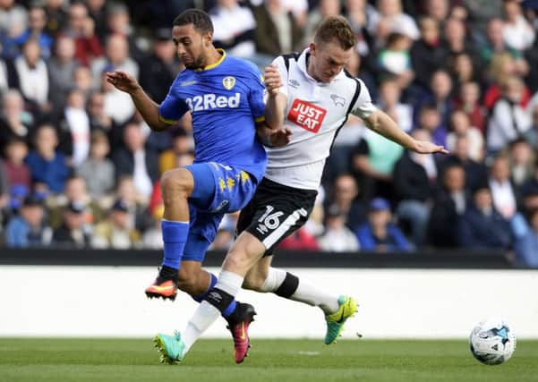 Kemar Roofe is pushed off the ball by Alex Pearce.
 Picture Bruce Rollinson