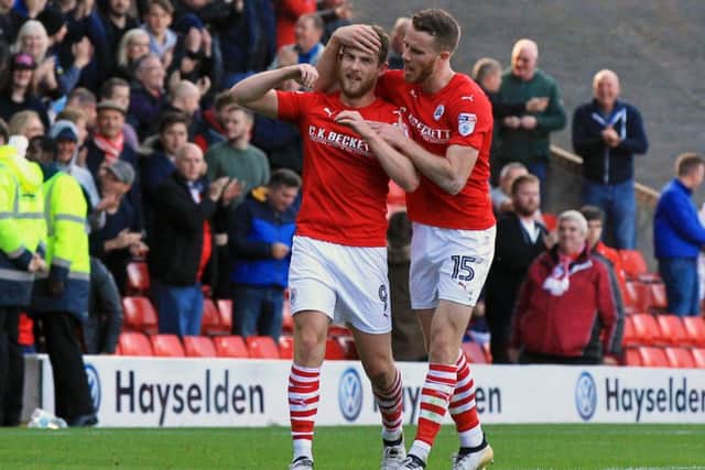 NICE ONE: Sam Winnall celebrates after scoring for Barnsley against Fulham on Saturday. Picture: Chris Etchells